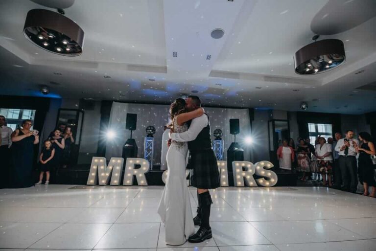 First dance wedding couple cuddling at Lochside Hotel