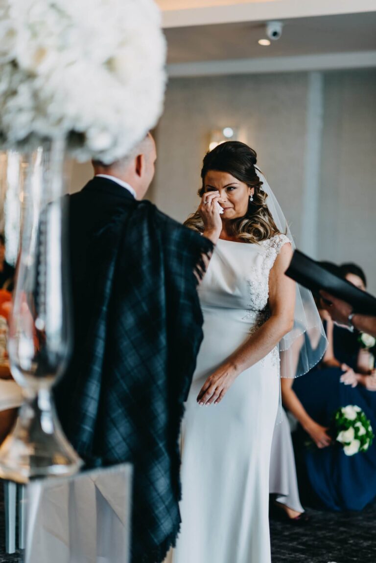 Emotional bride at her wedding ceremony at Lochside Hotel New Cumnock