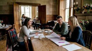 Couple and planner discuss music in Scottish manor