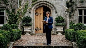 Venue manager outside Scottish manor wedding venue