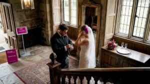 Bride and groom in Scottish manor wedding preparation