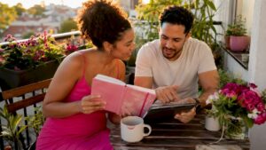 Couple planning bespoke wedding at home table