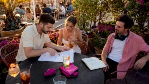 Couple discussing wedding plans with DJ