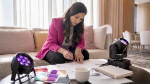 Event planner reviewing lighting documents