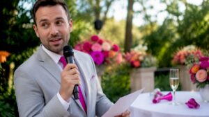 Professional MC speaking at wedding reception