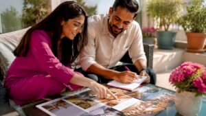 Couple reviewing wedding venue options at home